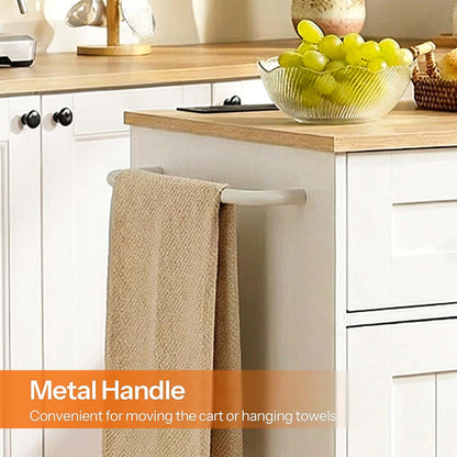 Kitchen counter with a towel rack holding a beige towel, grapes in a bowl, and decorative items.