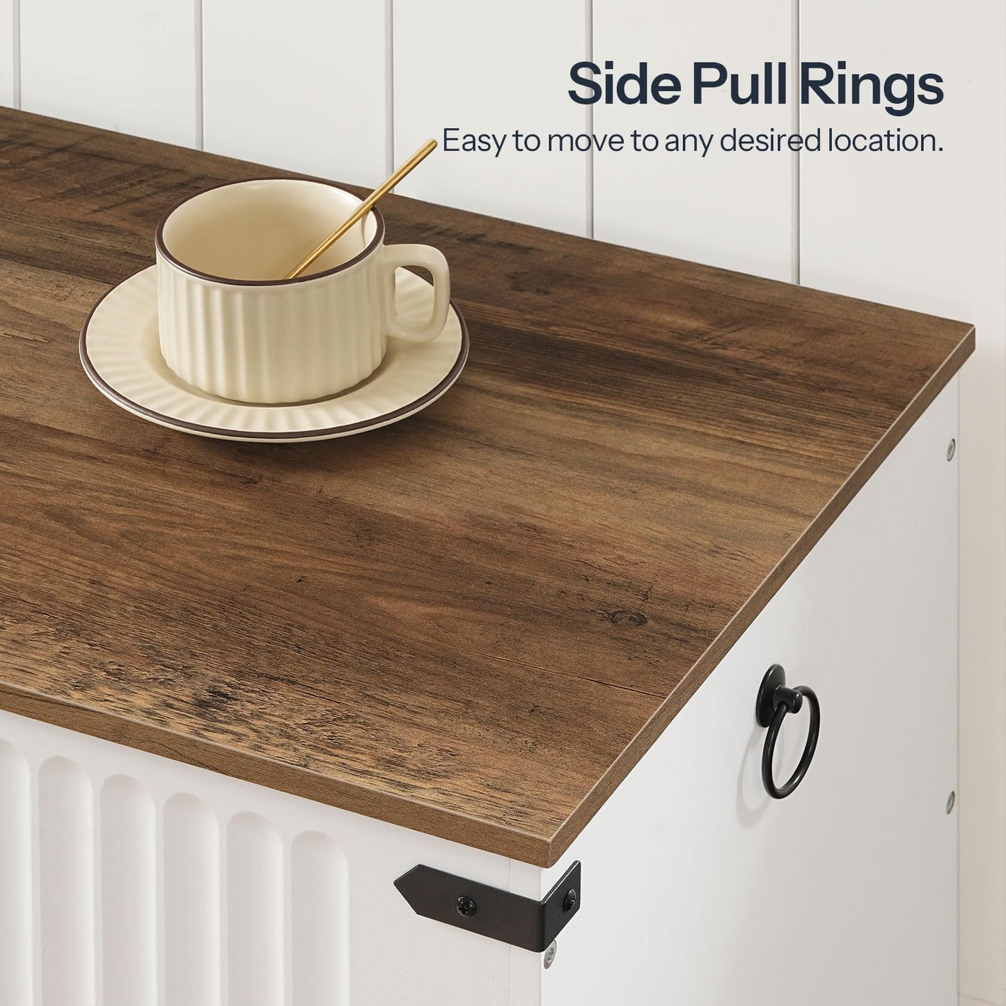 Cup with saucer on a wooden countertop with side pull ring hardware.