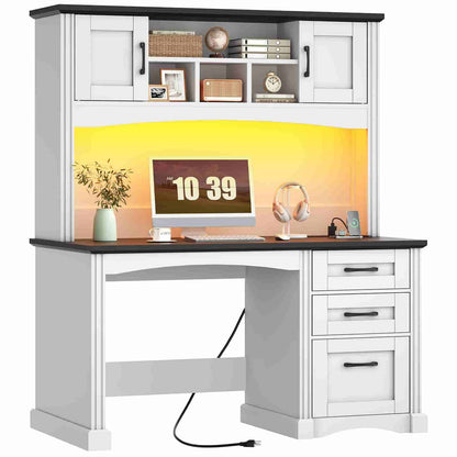 White office desk with black top, shelves, and drawers, featuring a computer setup.