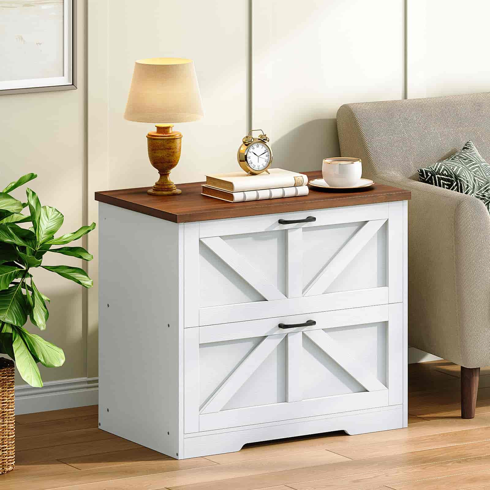 White storage cabinet with wooden top in a room setting with a lamp, clock, and plant.