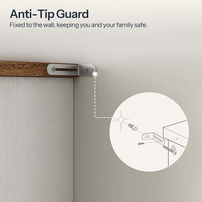 Anti-tip guard fixed to a wall with text indicating safety benefits.