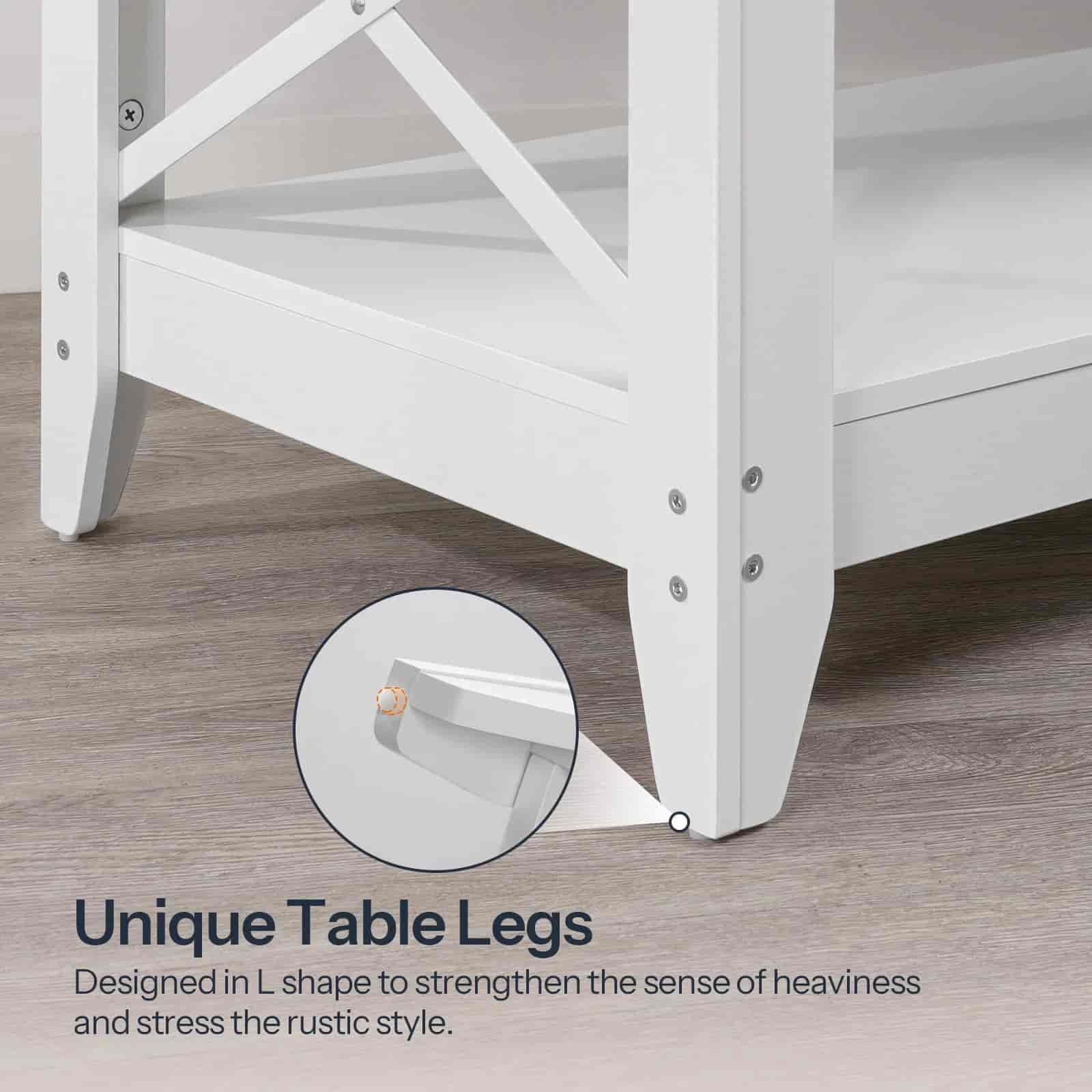 Close-up of a white table with unique L-shaped legs on a wooden floor.