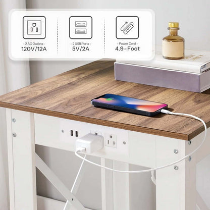 Desk with a smartphone charging on a wireless charging pad, power outlet, and USB ports visible.