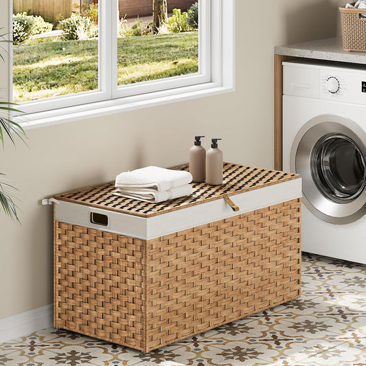 Wicker laundry basket with towels and bottles in a laundry room with a washing machine.