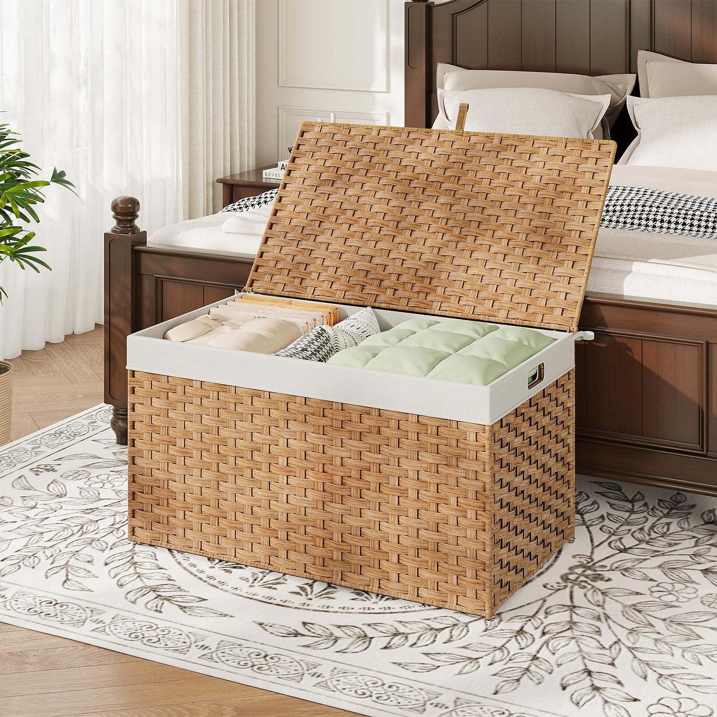 Woven storage basket with a lid on a patterned rug in a bedroom setting.