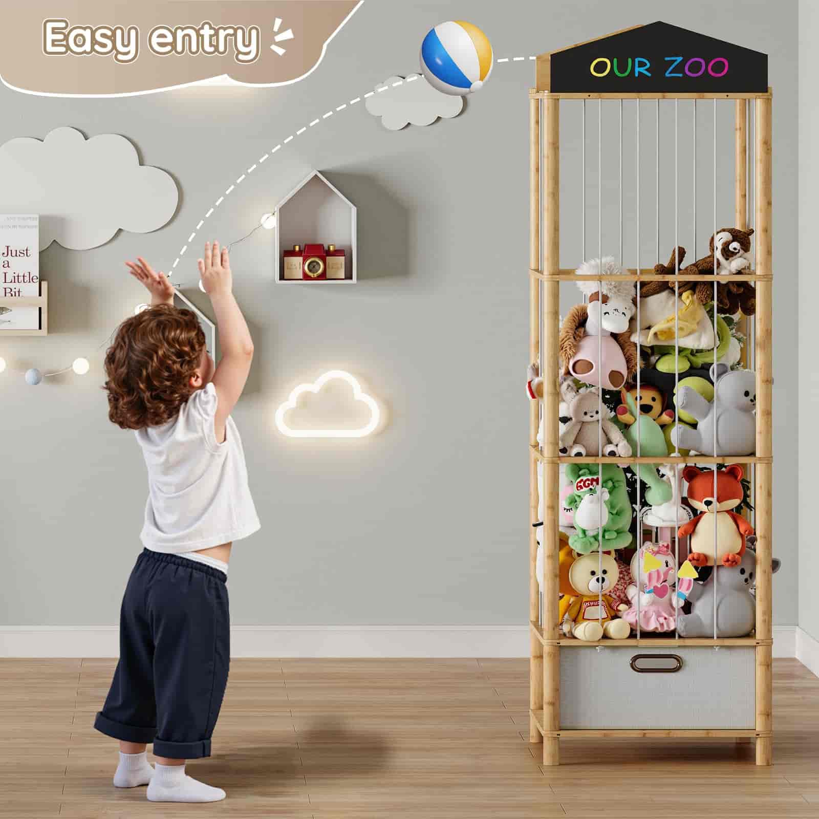Child reaching for a toy on a tall wooden shelf labeled 'Our Zoo' in a room with decorative lighting and wall art.