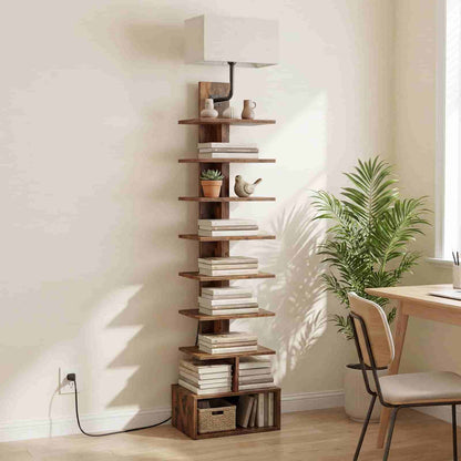 Tall wooden bookshelf with books and decorative items in a room with a desk and plant.