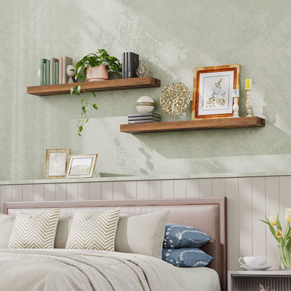 Decorative shelves above a bed with books, plants, and framed pictures.