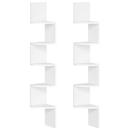 White wall-mounted shelving unit with geometric design on a white background