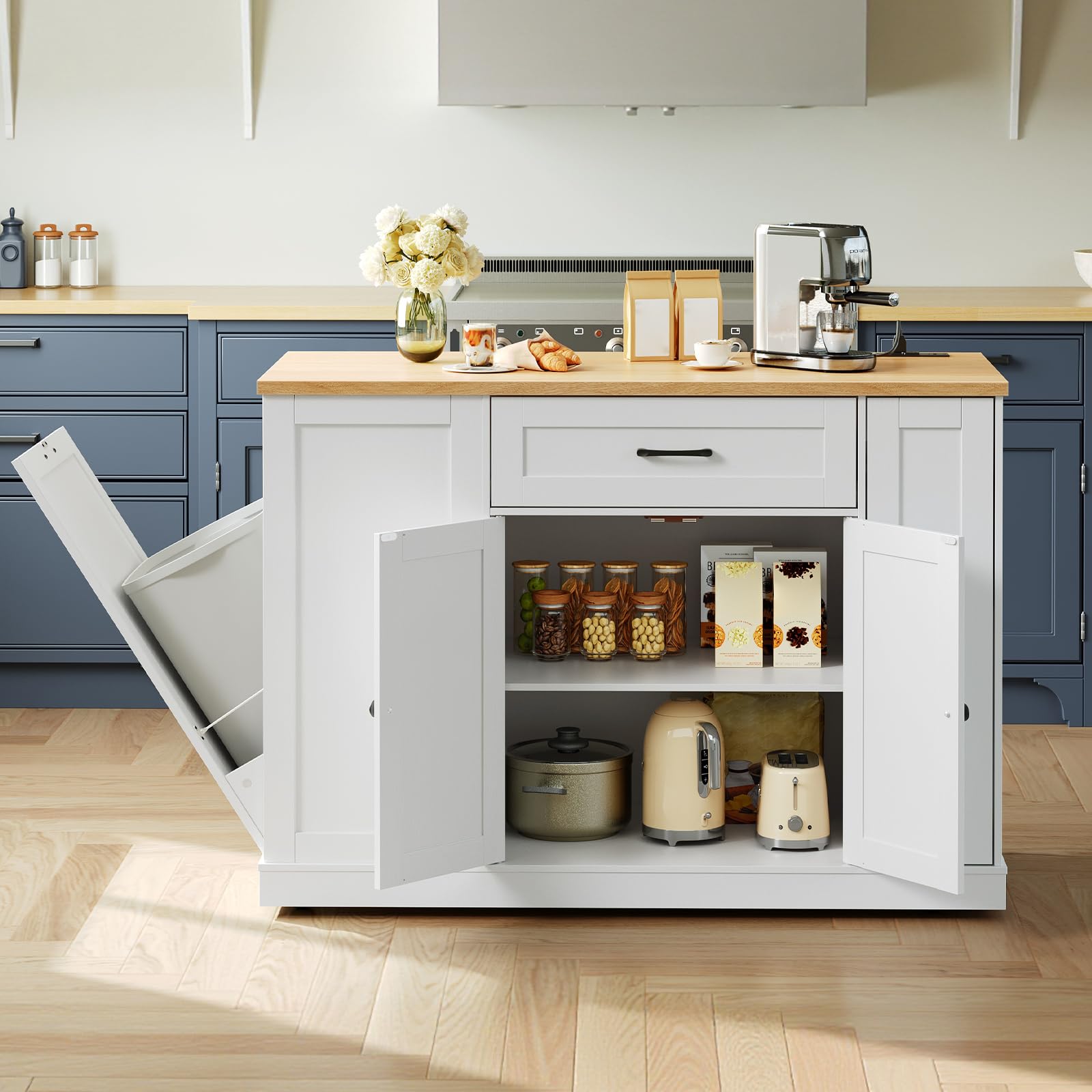 Kitchen island with open cabinet revealing kitchen appliances and items