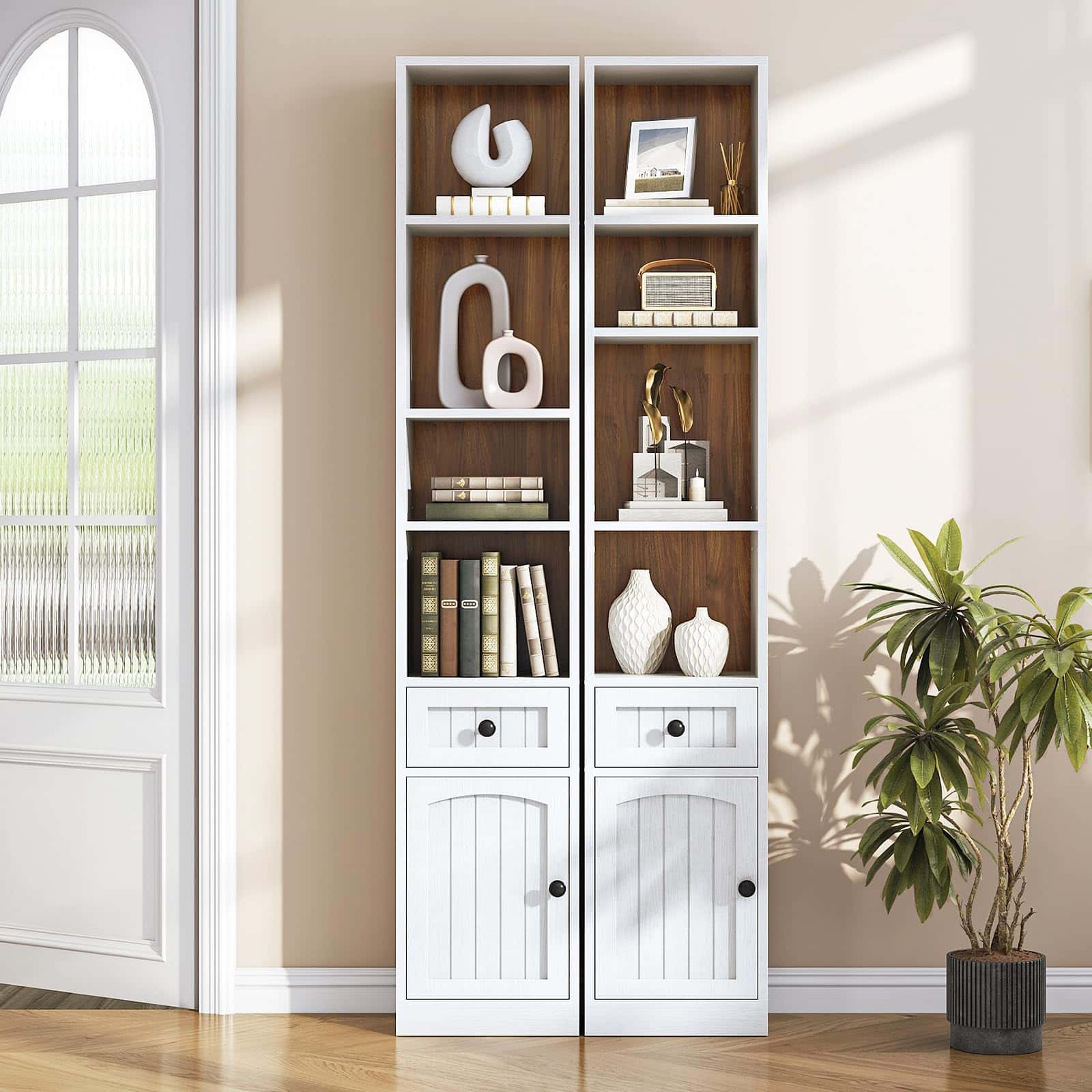 Tall white bookshelf with wooden shelves against a beige wall.