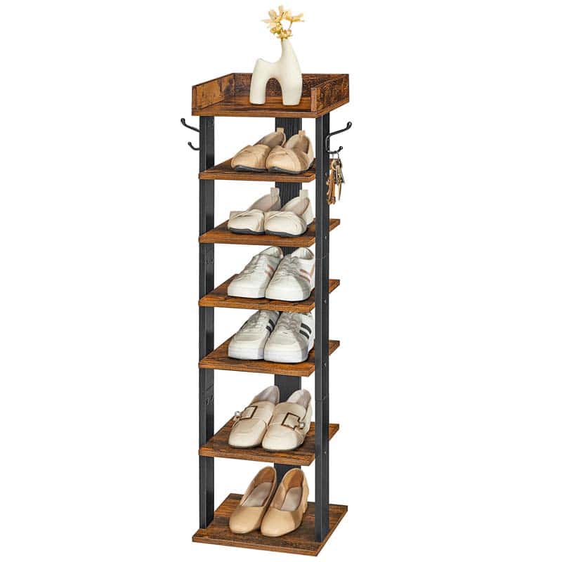 A 6-tier wooden shoe rack with a black metal frame and side hooks, shown holding various shoes and topped with a decorative ceramic deer figurine, on a solid white background.