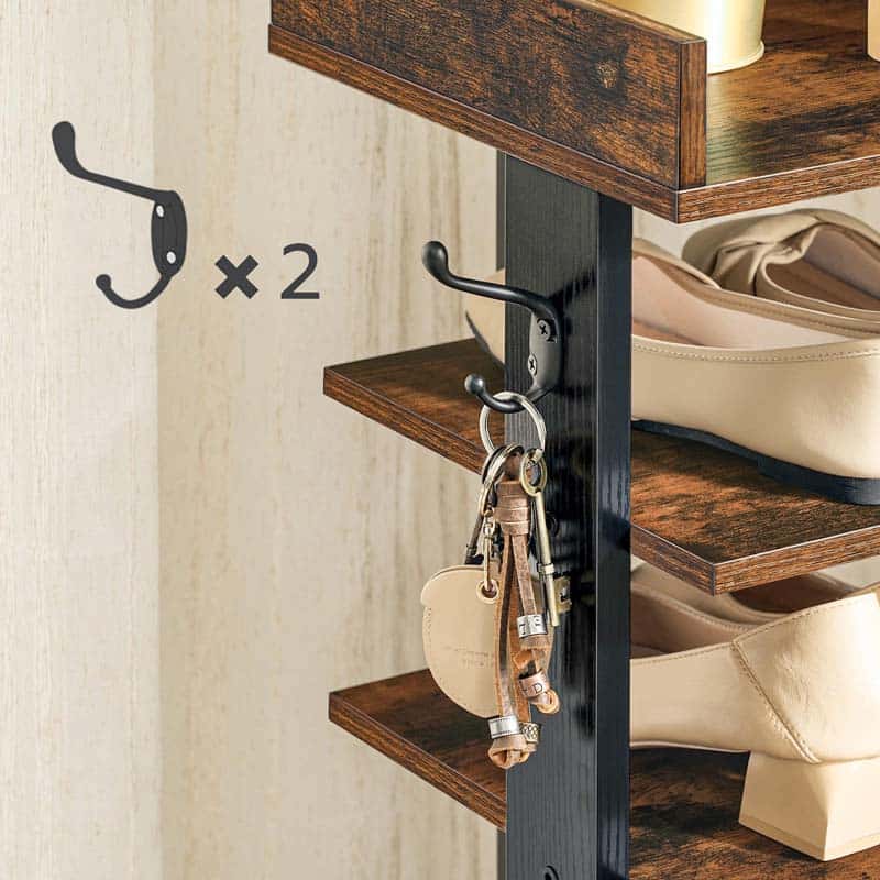 Wooden shoe rack with two hooks, one of which is used to hang keys and a small bag.