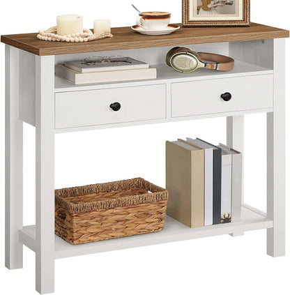 White console table with wooden top, drawers, and shelf, decorated with books, a basket, and decorative items.