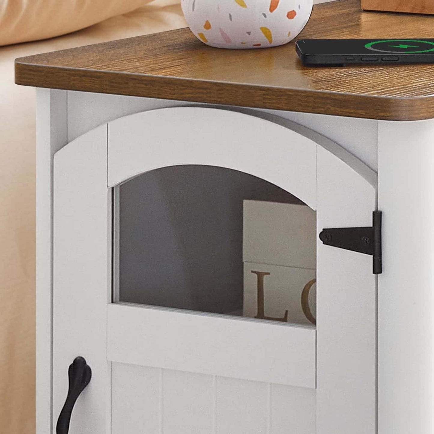 Small wooden table with a white cabinet underneath, featuring a glass door.