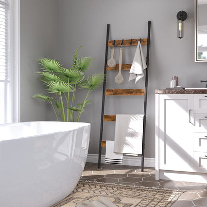 Elegant bathroom towel ladder rack leaning against the wall next to a modern luxury bathtub.