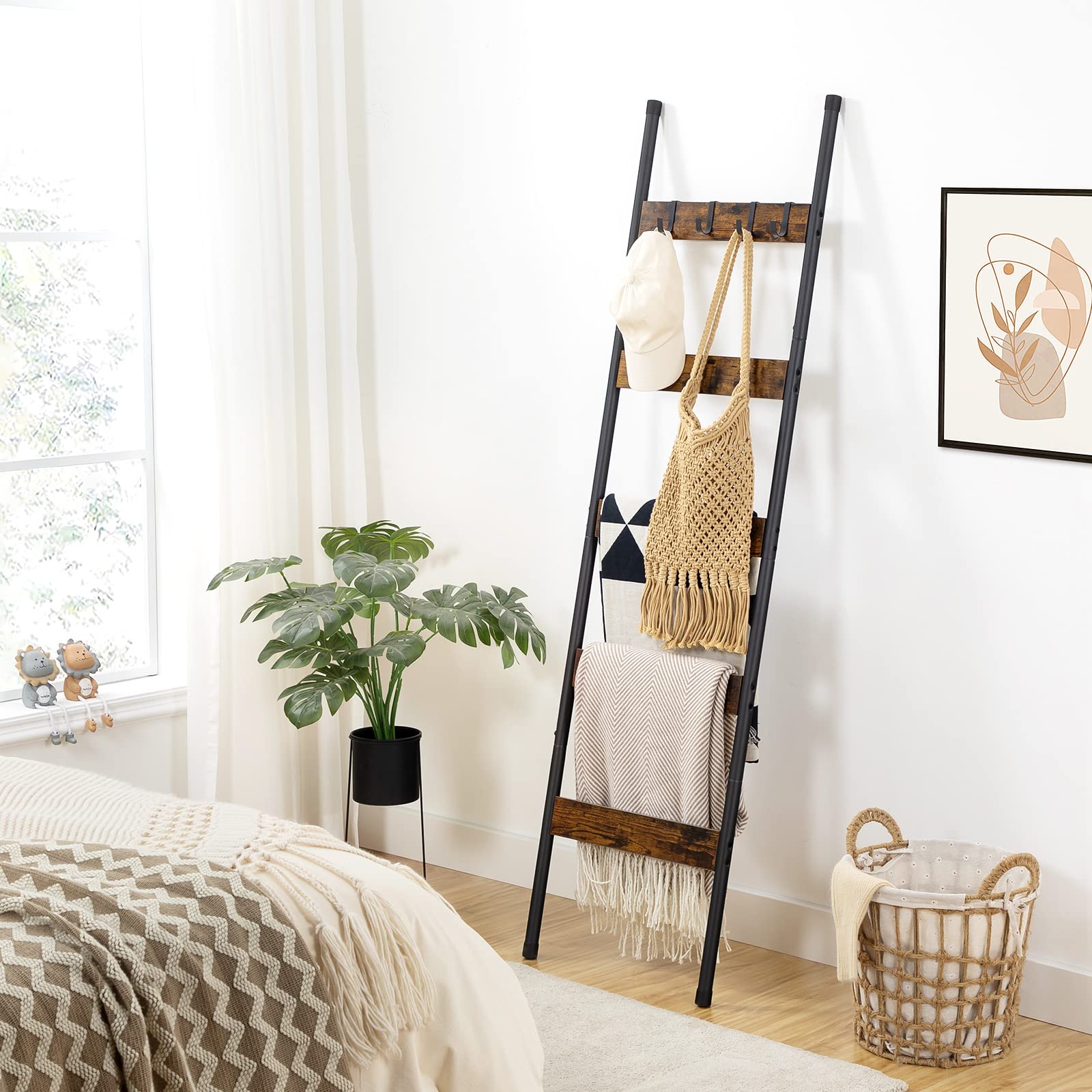 Bedroom blanket ladder decor leaning next to a bed holding warm winter throws.
