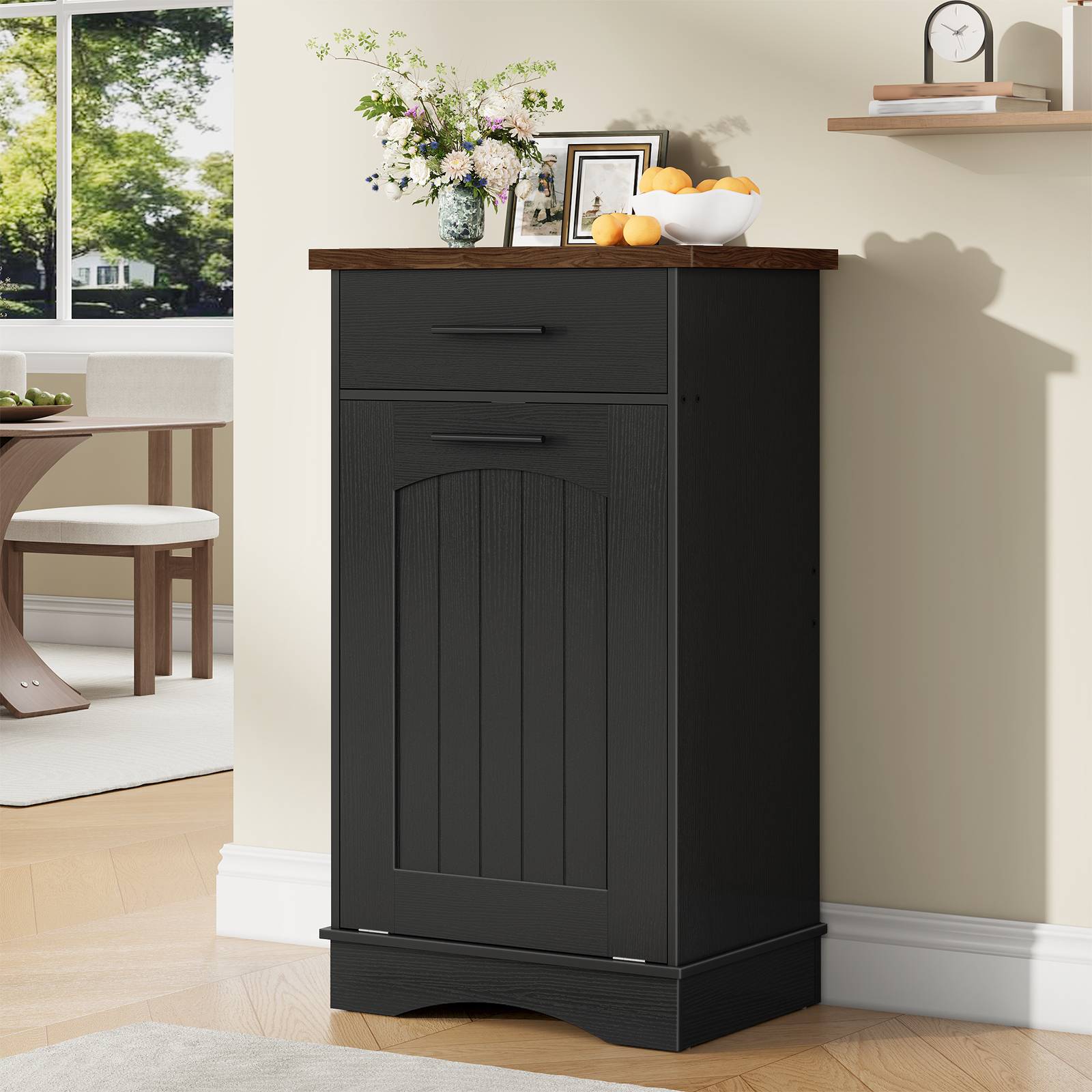 Closed black beadboard storage cabinet with a rustic brown wood top styled as an accent piece in a dining room.