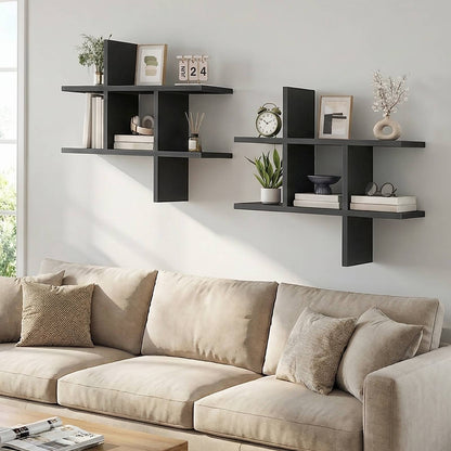 Two black intersecting display shelves installed in a staggered layout on a living room wall above a couch.