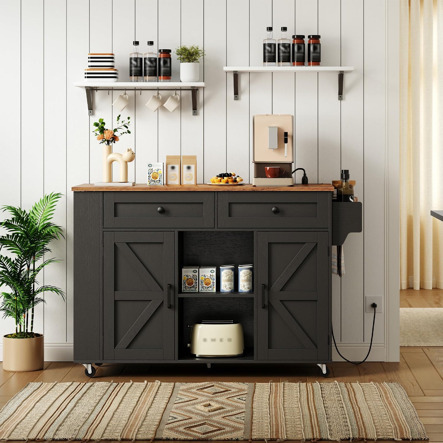 Black kitchen island storage cabinet with fully opened barn doors showing adjustable shelves and wide interior layouts.