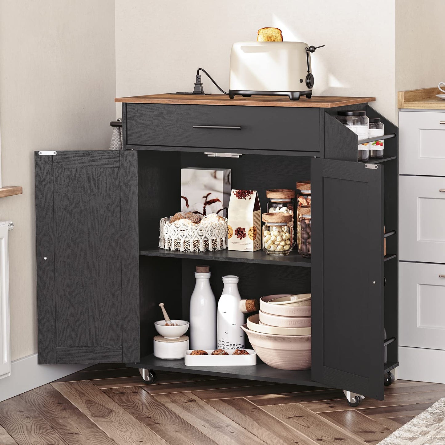 Black kitchen utility cart with opened double doors showing adjustable shelves holding dinner plates and jars.
