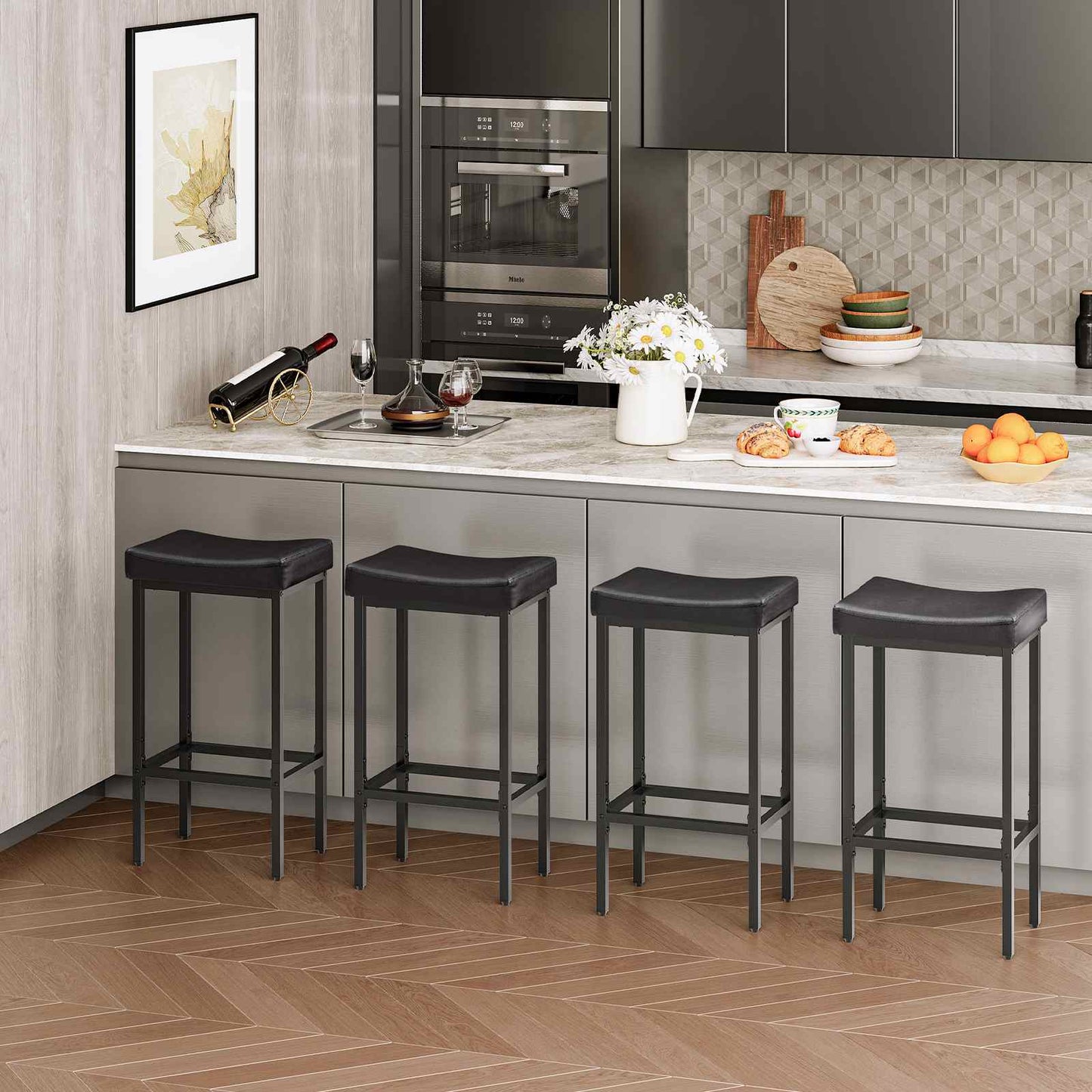 Four black faux leather barstools neatly lined up under a modern marble kitchen island counter.
