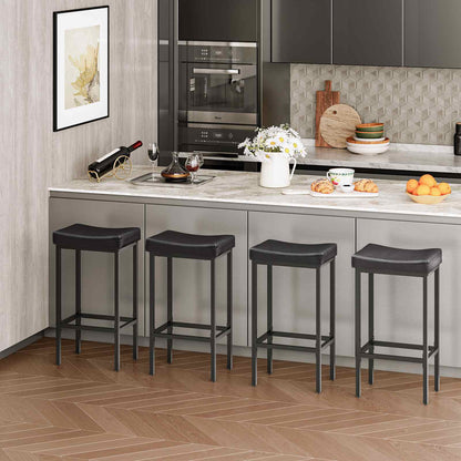 Four black faux leather barstools neatly lined up under a modern marble kitchen island counter.