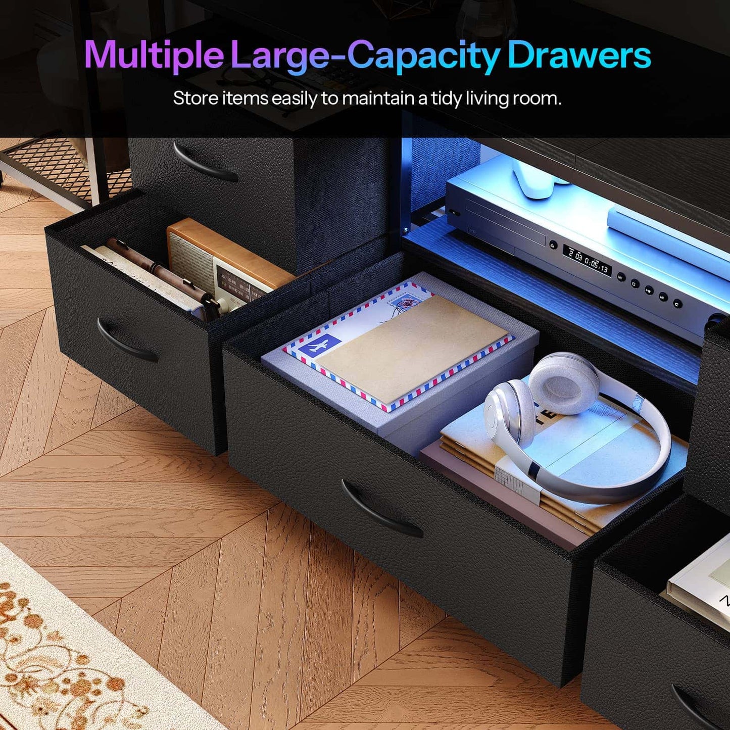 Black under-desk storage drawers shown open, revealing a DVD player, books, and headphones inside, with a text overlay at the top reading 'Multiple Large-Capacity Drawers'.