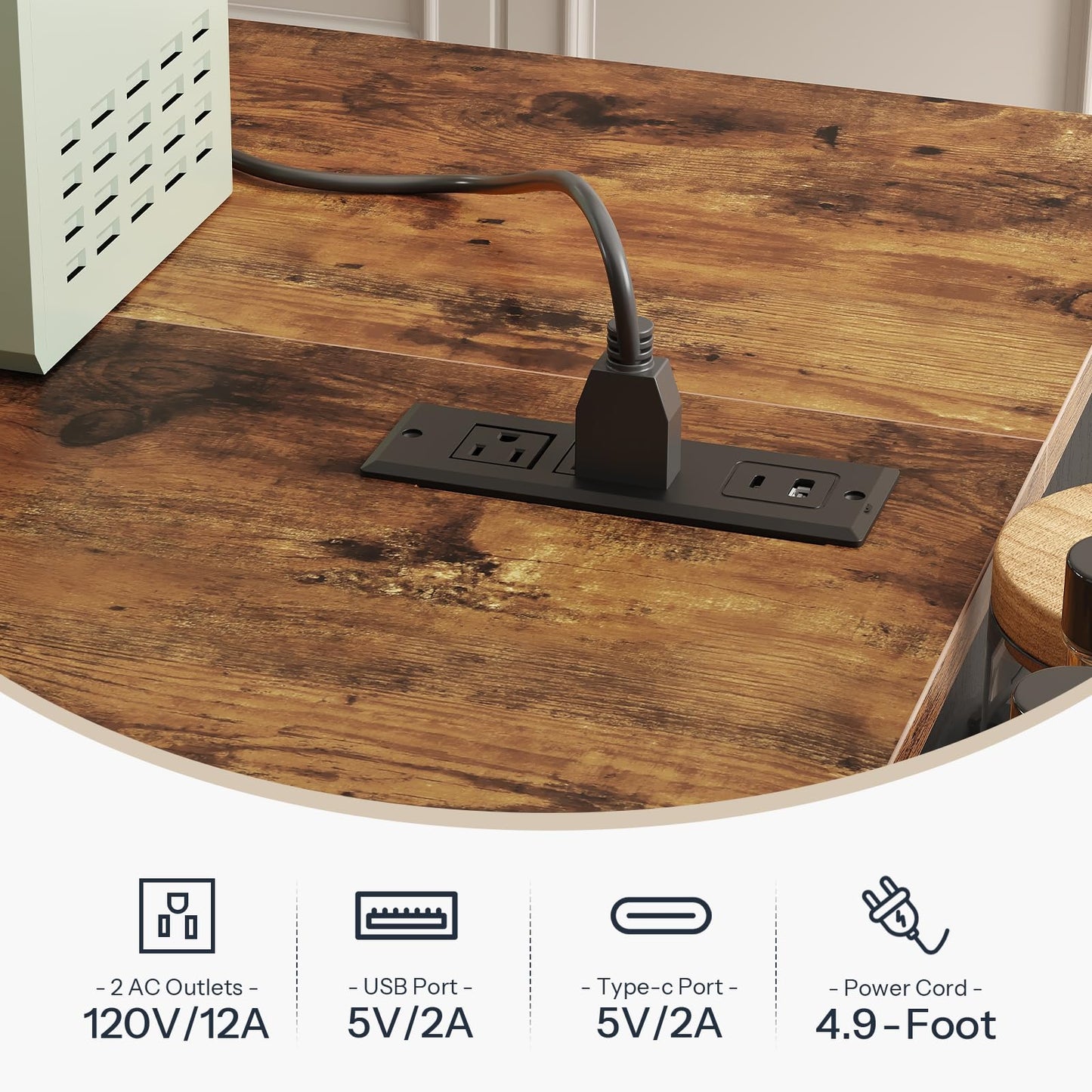 Close up of the embedded tabletop charging station showing AC outlets, USB ports, and a 4.9 foot flexible power cord on deep rustic wood.