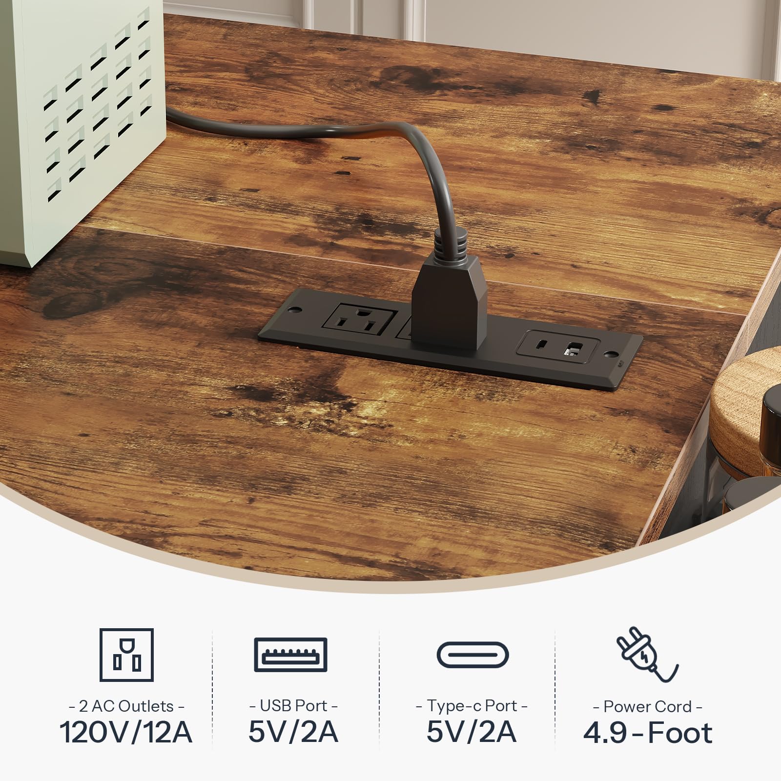 Close up of the embedded tabletop charging station showing AC outlets, USB ports, and a 4.9 foot flexible power cord on deep rustic wood.