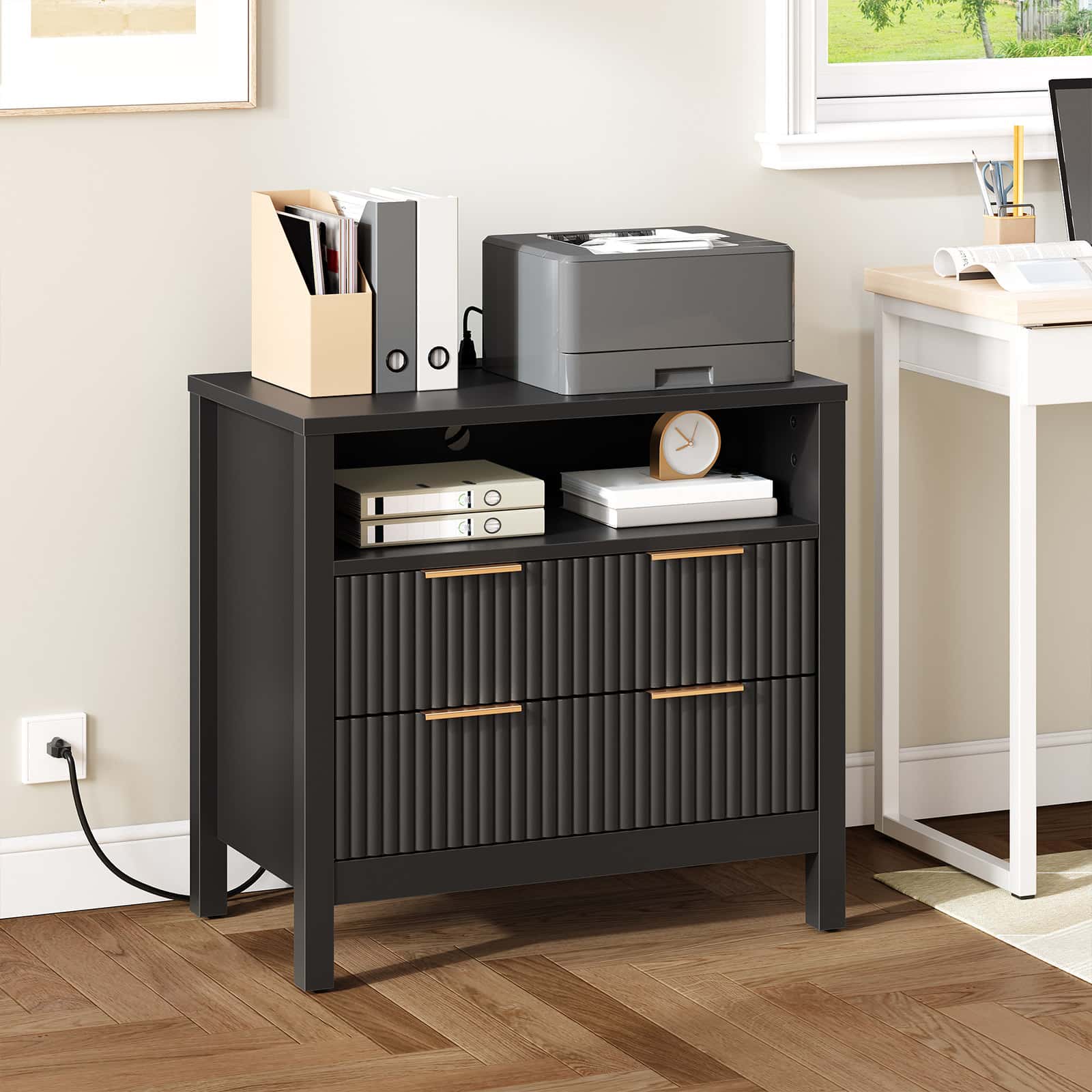 Black storage cabinet with drawers in a home office setting