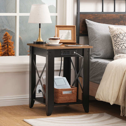Cozy bedroom scene showing the brown wood bedside table styled with a classic desk lamp and a storage basket on the lower shelf next to the mattress.