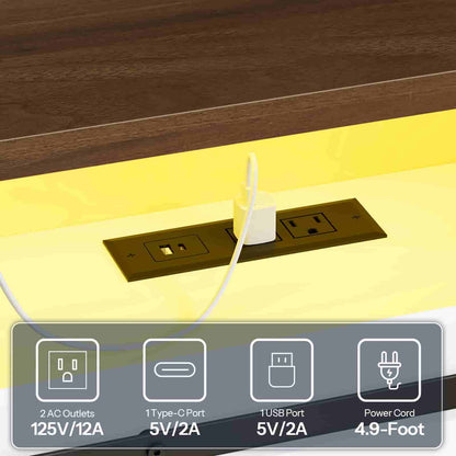 Close-up of the embedded power strip on the headboard shelf, featuring standard AC outlets and USB ports.