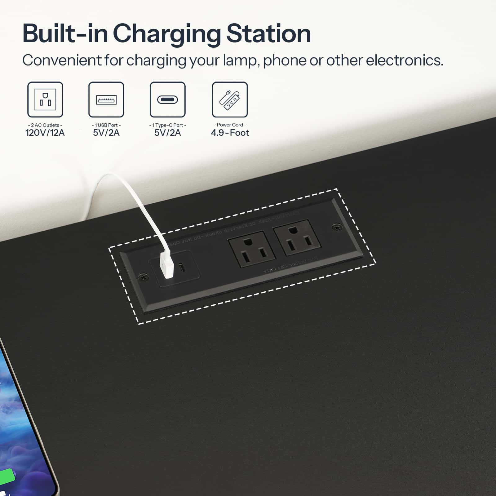 Built-in charging station with power outlets and cable on a desk surface.