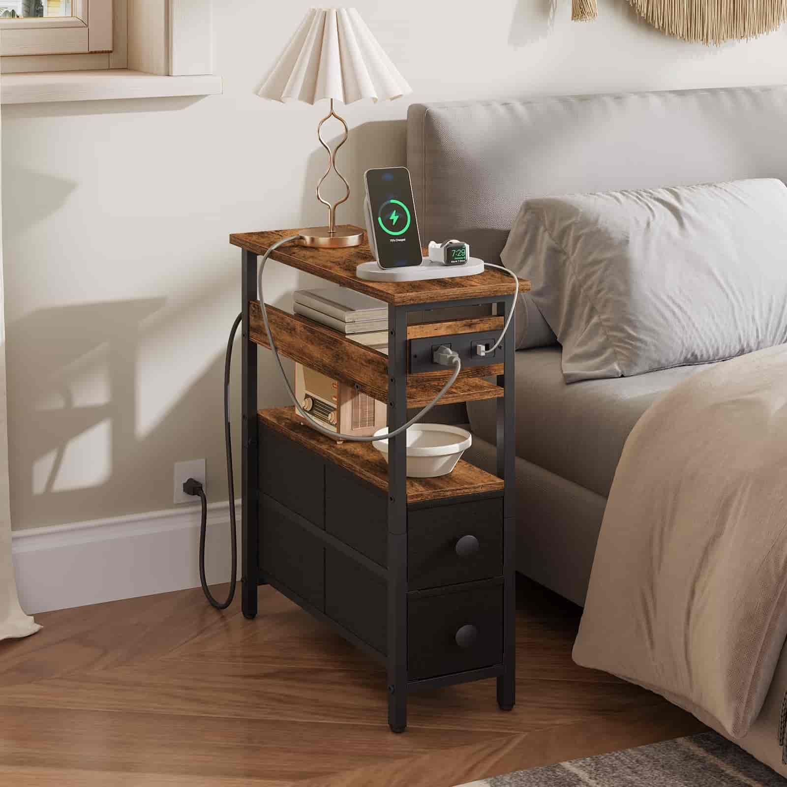Wooden nightstand with electronic devices in a bedroom setting