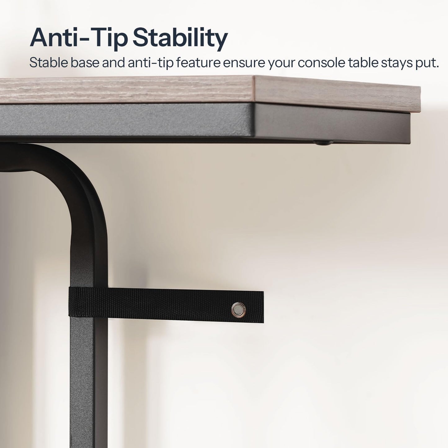 Technical close up demonstrating the console table wall anti-tip safety anchor straps screwed into a wall.