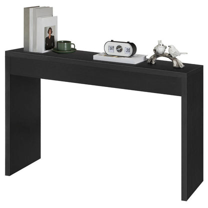 Black console table with decorative items on a white background