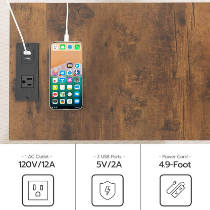 Wall-mounted power outlet with two USB ports and a smartphone charging on a wooden surface.