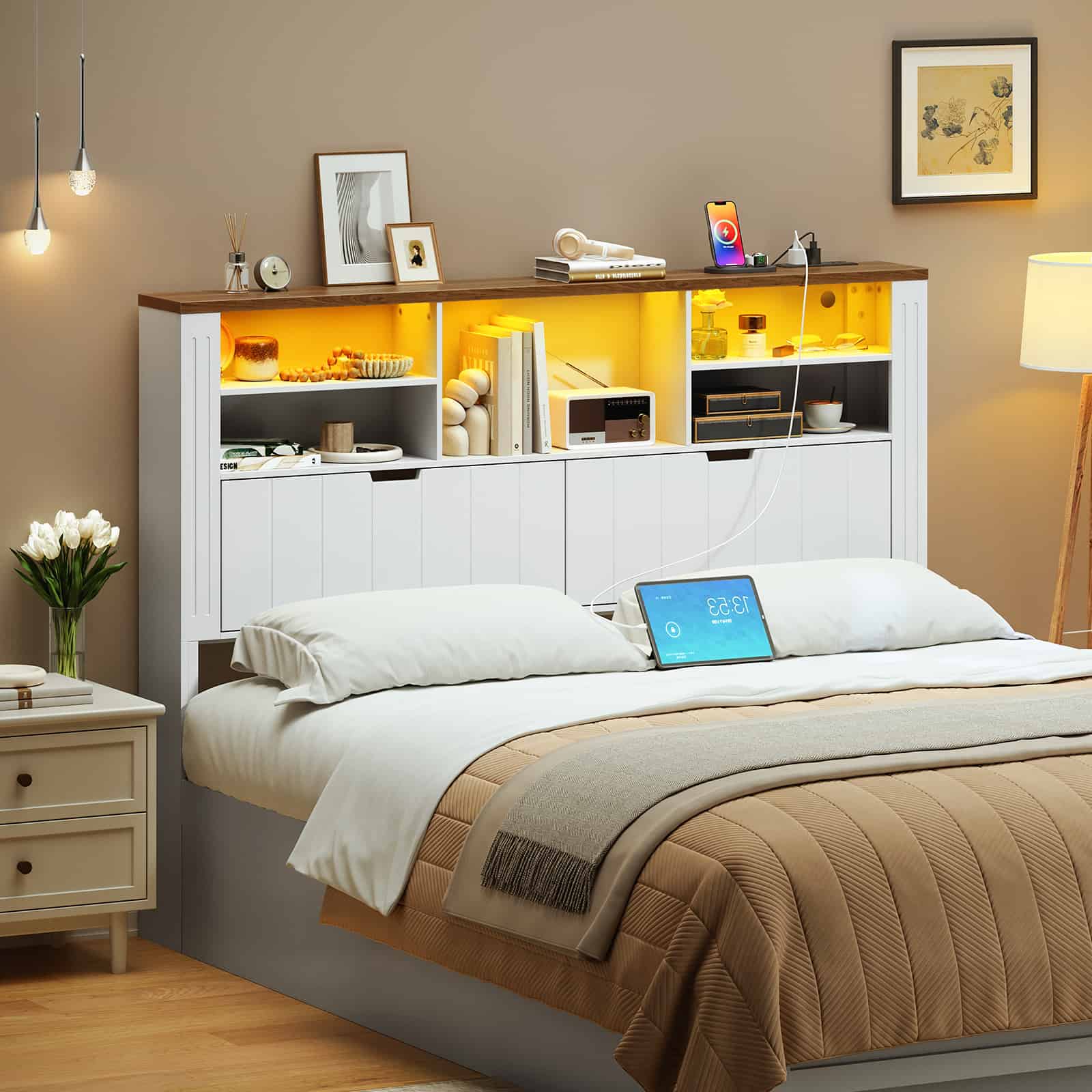 Side angled view of the farmhouse storage headboard behind pillows, showing a laptop on the bed in a modern home.
