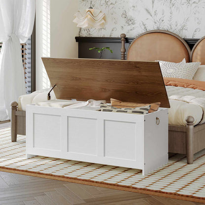 Farmhouse white blanket chest with a dark brown wooden top panel styled neatly in a master bedroom suite as a storage credenza.