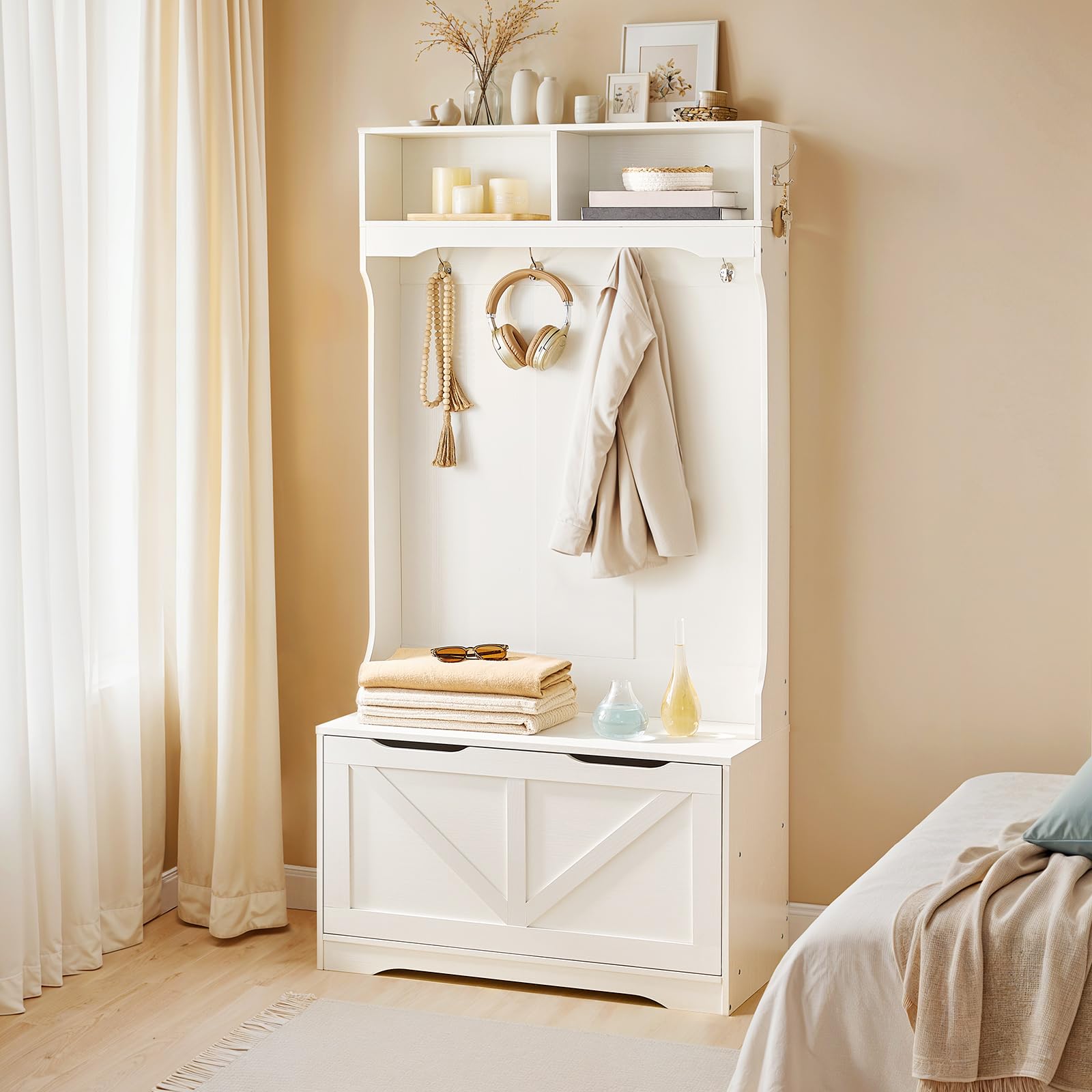 Farmhouse white bedroom accent storage cabinet bench standing stably against a wall next to a bright window.