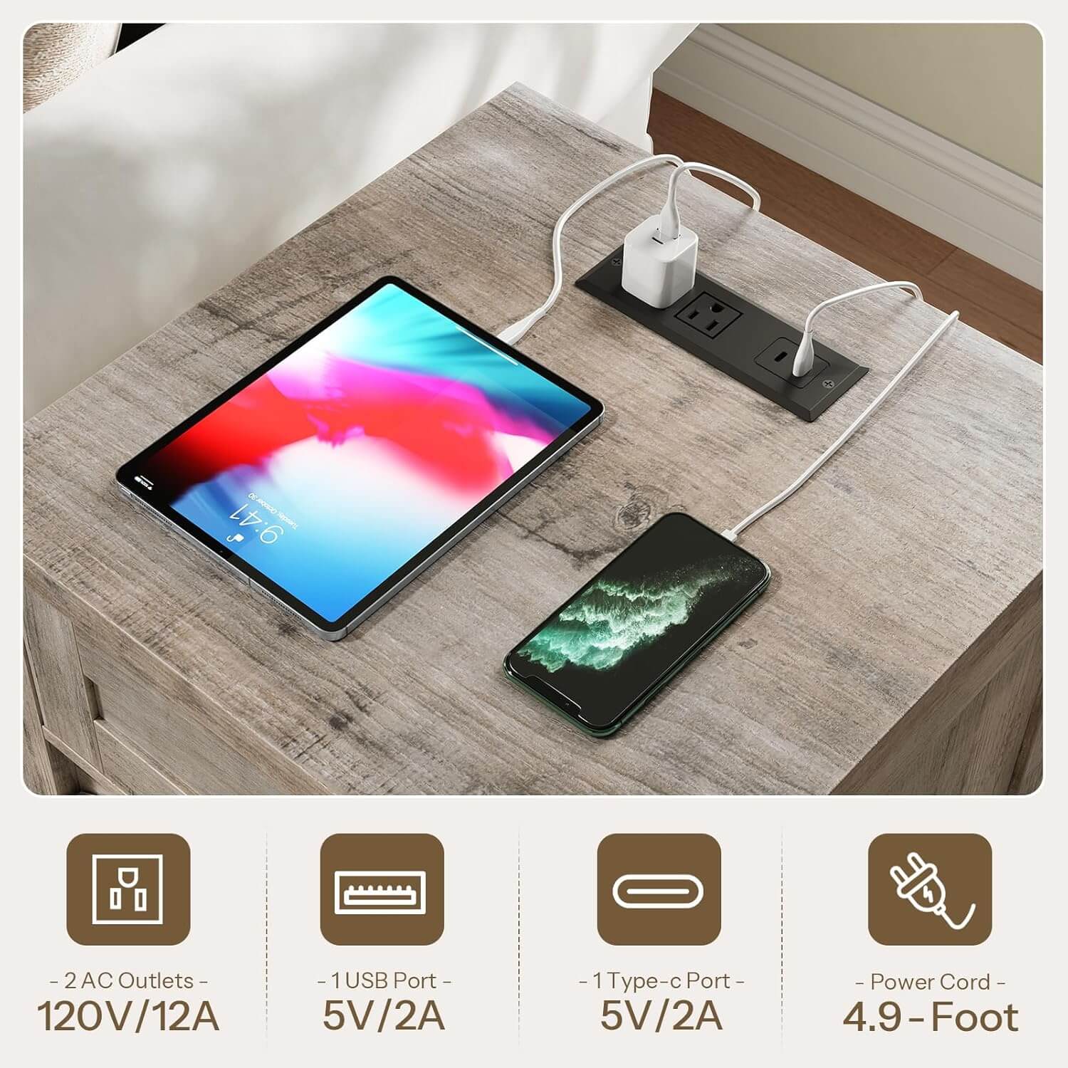 Tablet and smartphone charging on a wooden surface with power outlet and cable.