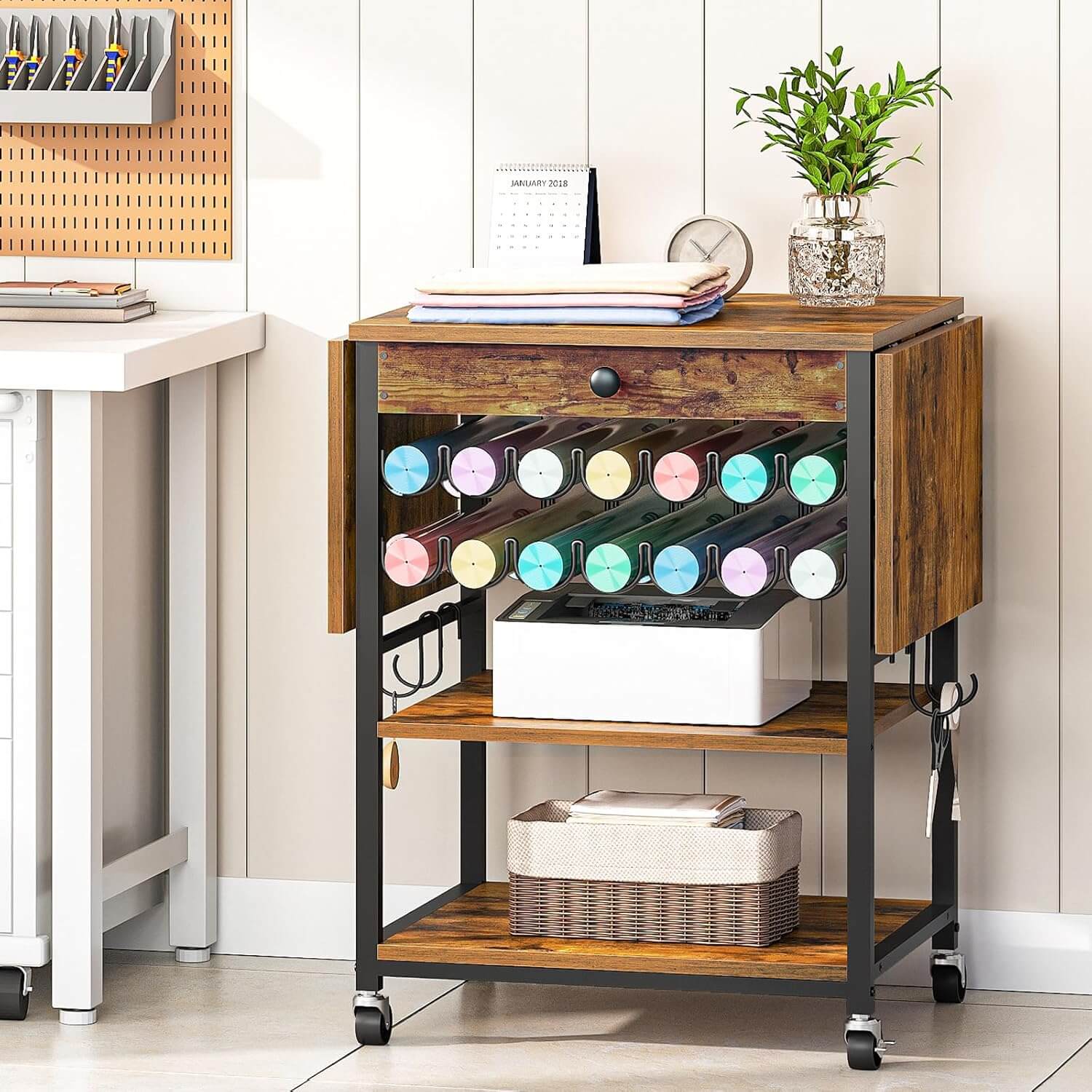 Wooden storage cart with drawers and shelves in a home office setting
