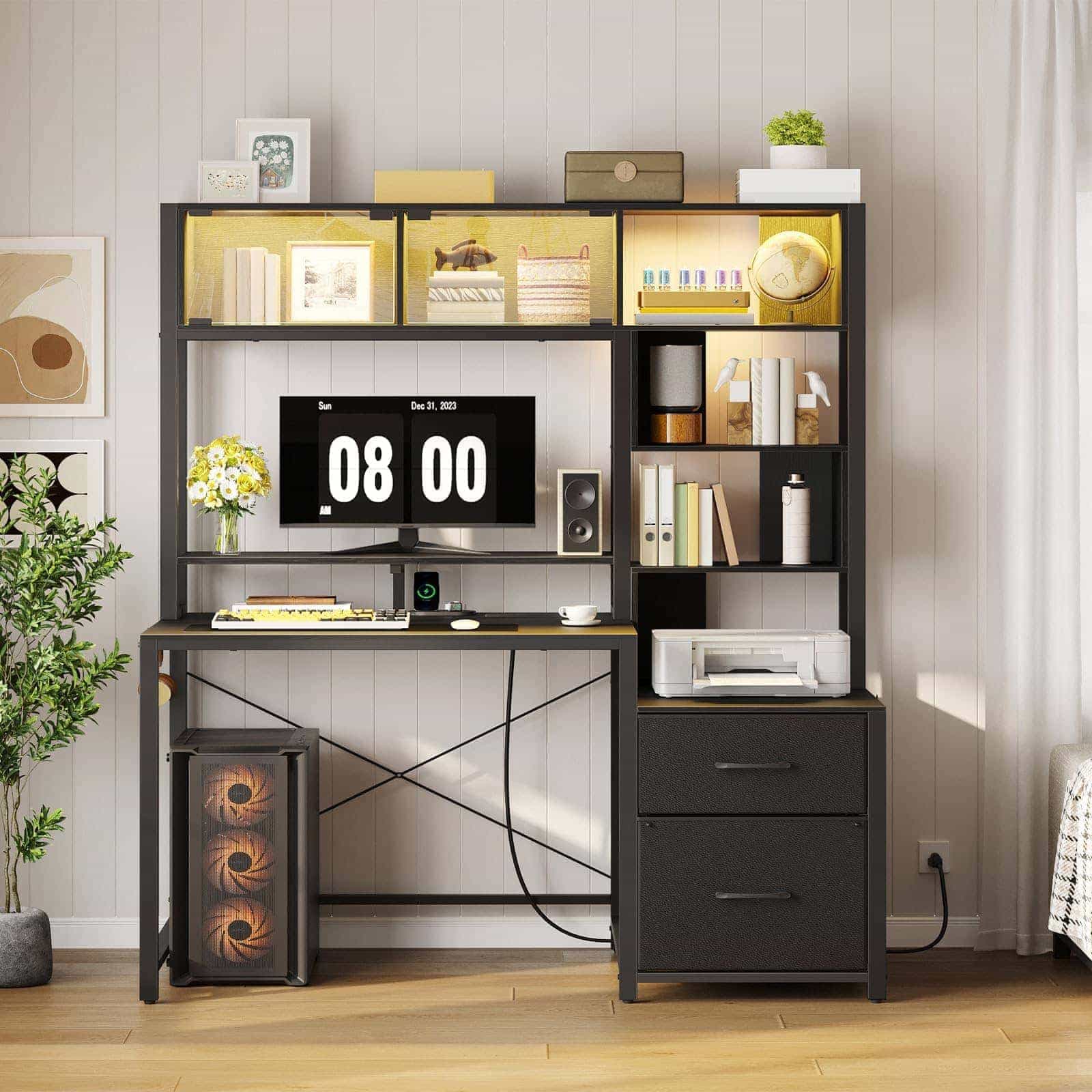 Black modern computer desk with hutch and drawers styled beautifully in a sunlit home office setup.