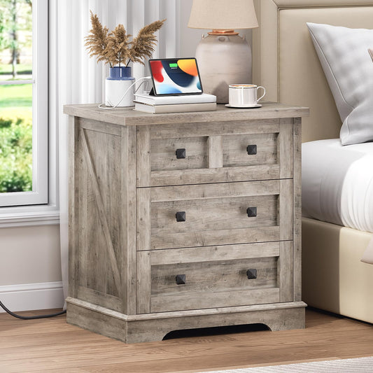 HOOBRO farmhouse greige nightstand with a hidden charging station standing next to a bed holding a tablet.