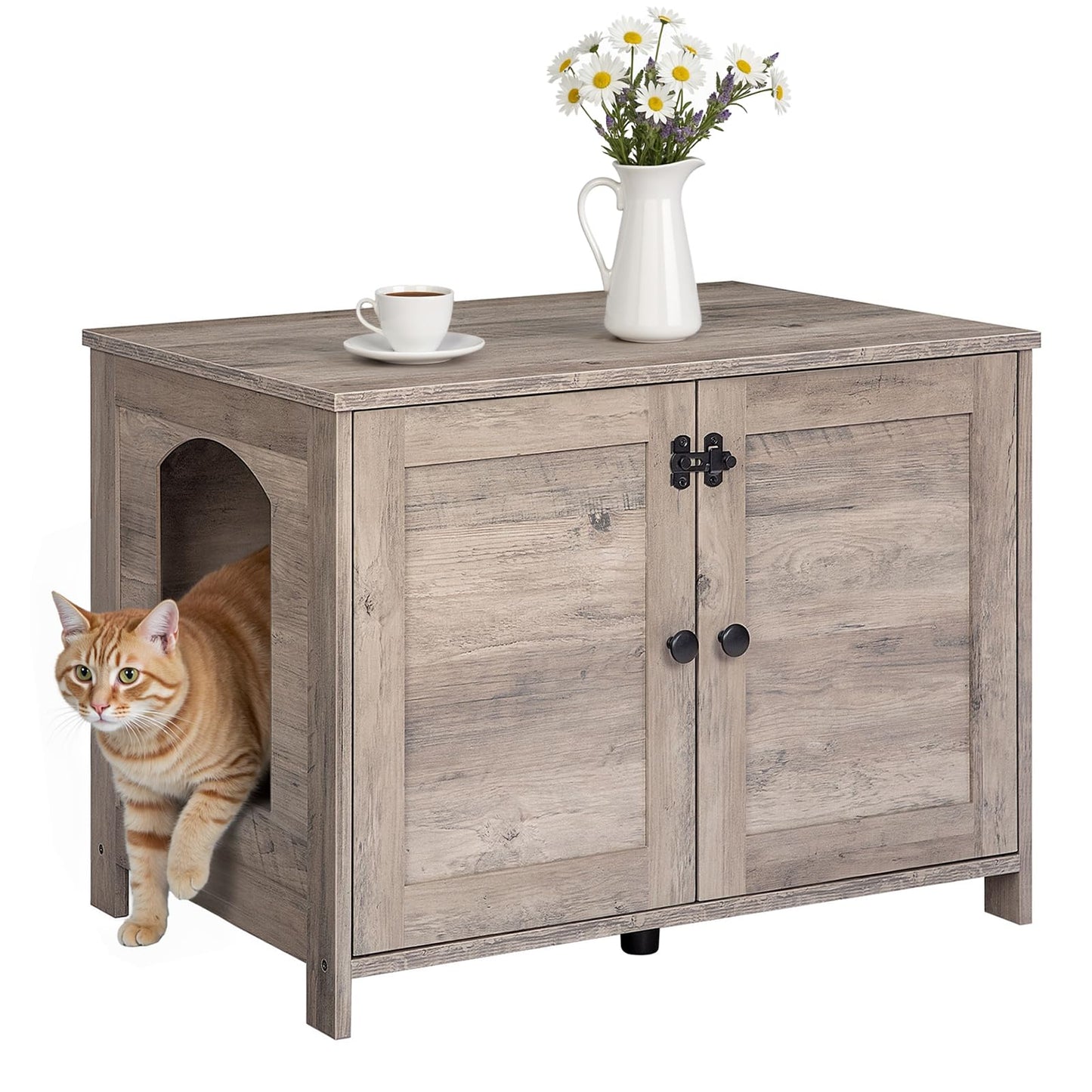 Wooden pet house with a cat peeking out, a cup of coffee, and a vase of flowers on top.