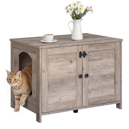 Wooden pet house with a cat peeking out, a cup of coffee, and a vase of flowers on top.