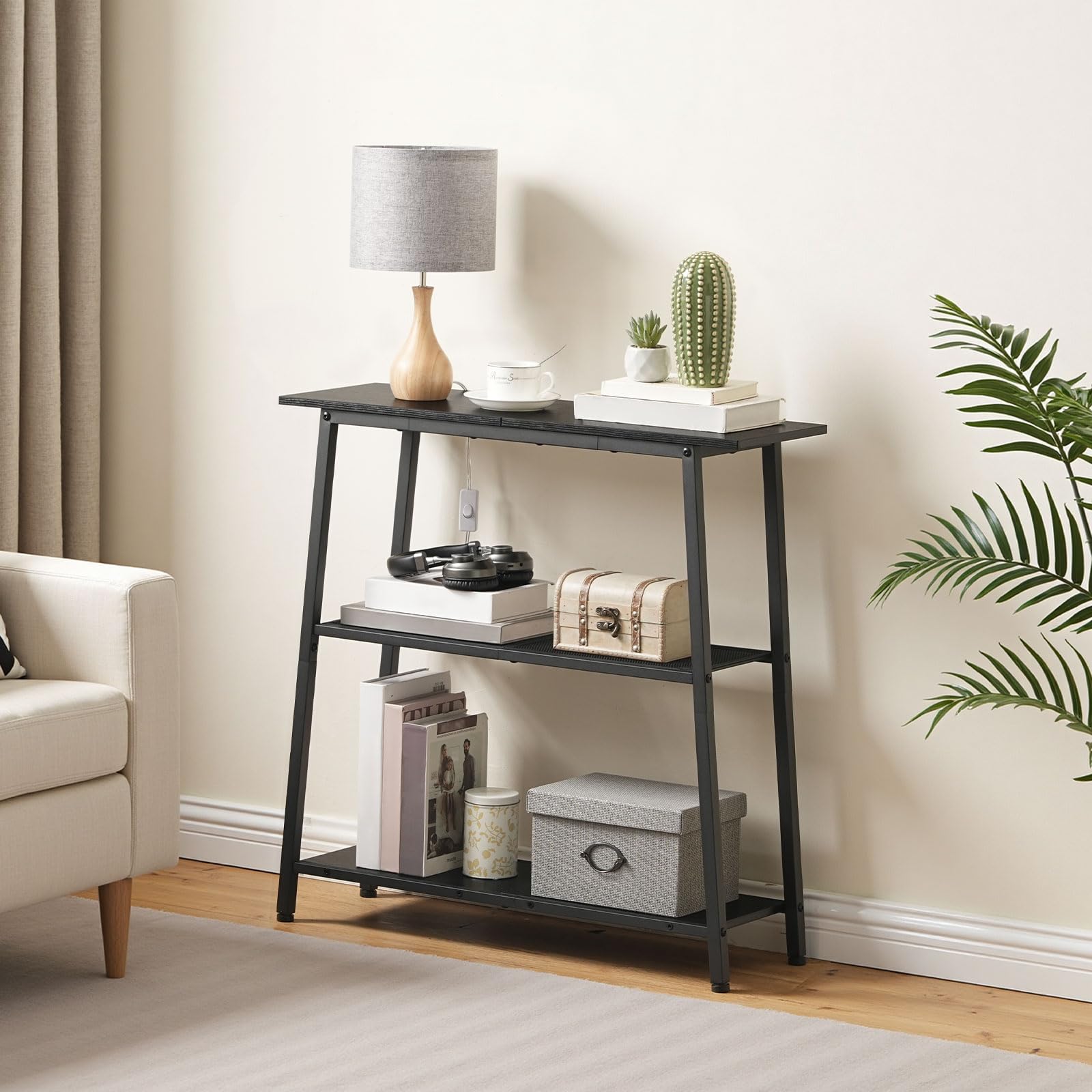 HOOBRO slim black console table with 3-tier open storage shelves holding a table lamp next to a living room sofa