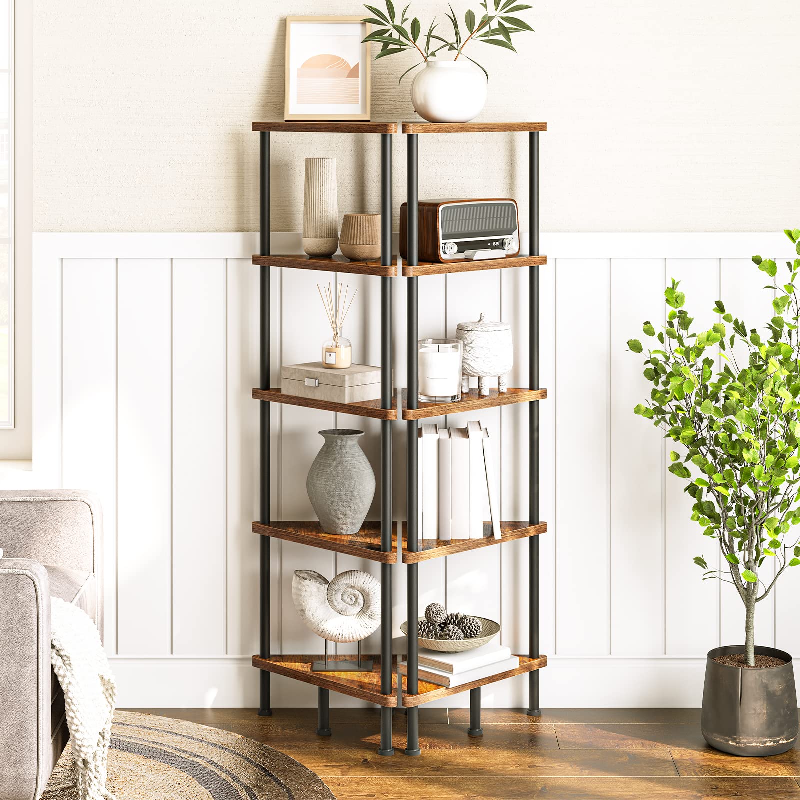 Industrial 5-tier corner bookshelf styled in a living room corner next to a green plant.