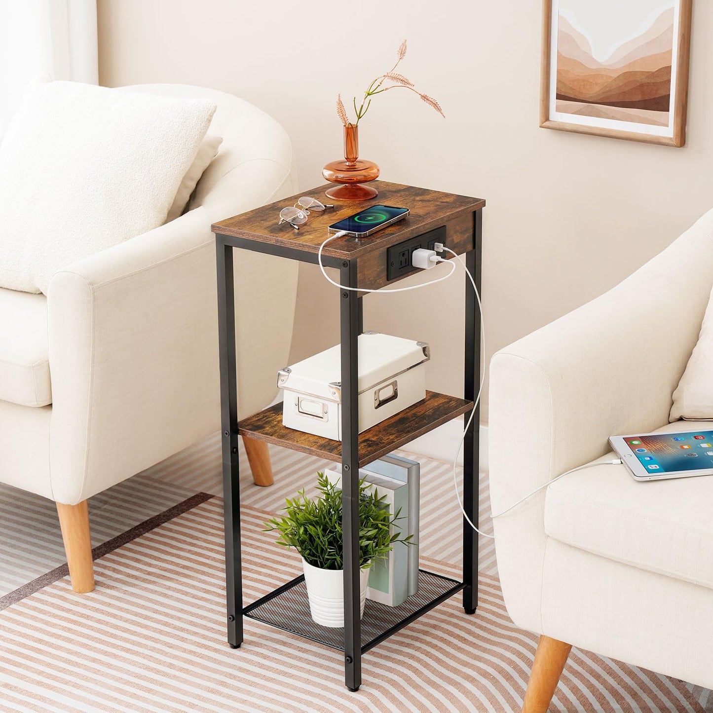 Industrial style accent table with storage shelves standing beside a living room couch.